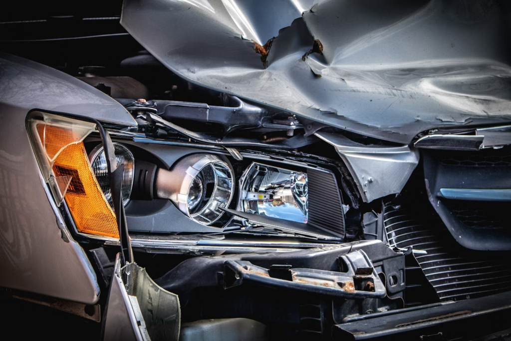 The front end of a heavily damaged, crashed car.