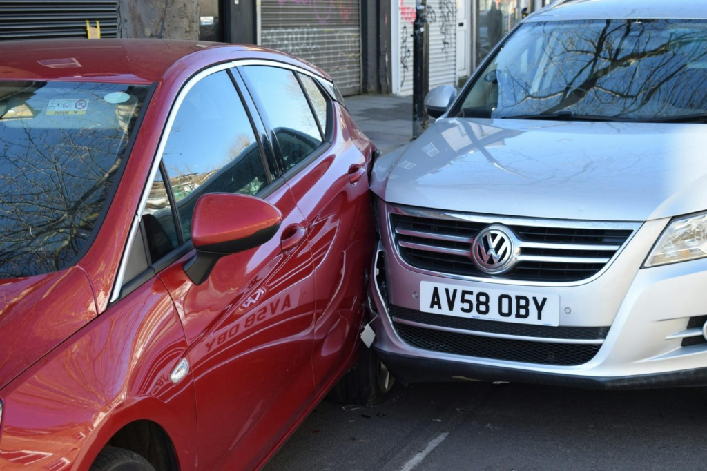A car accident with a silver and red car