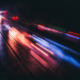 Long exposure of motor vehicle light streaks on a busy road at night