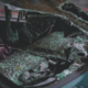Close-up of a car with a severely cracked and shattered windshield