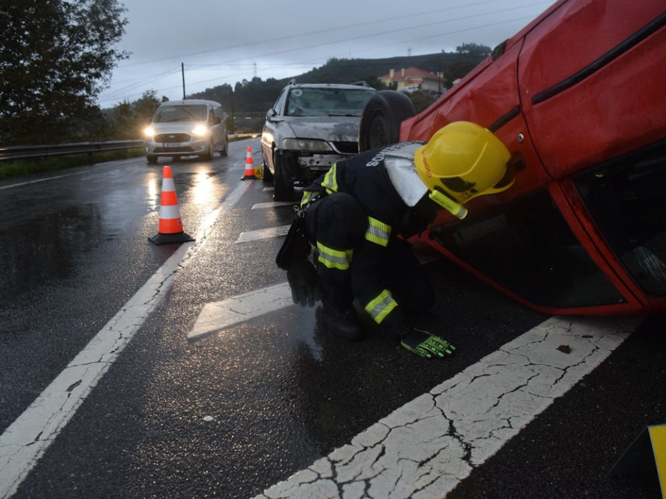 Emergency responders at the scene of a highway collision involving multiple vehicles