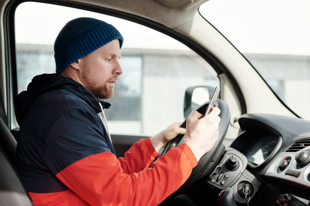 Driver looking at a mobile phone 